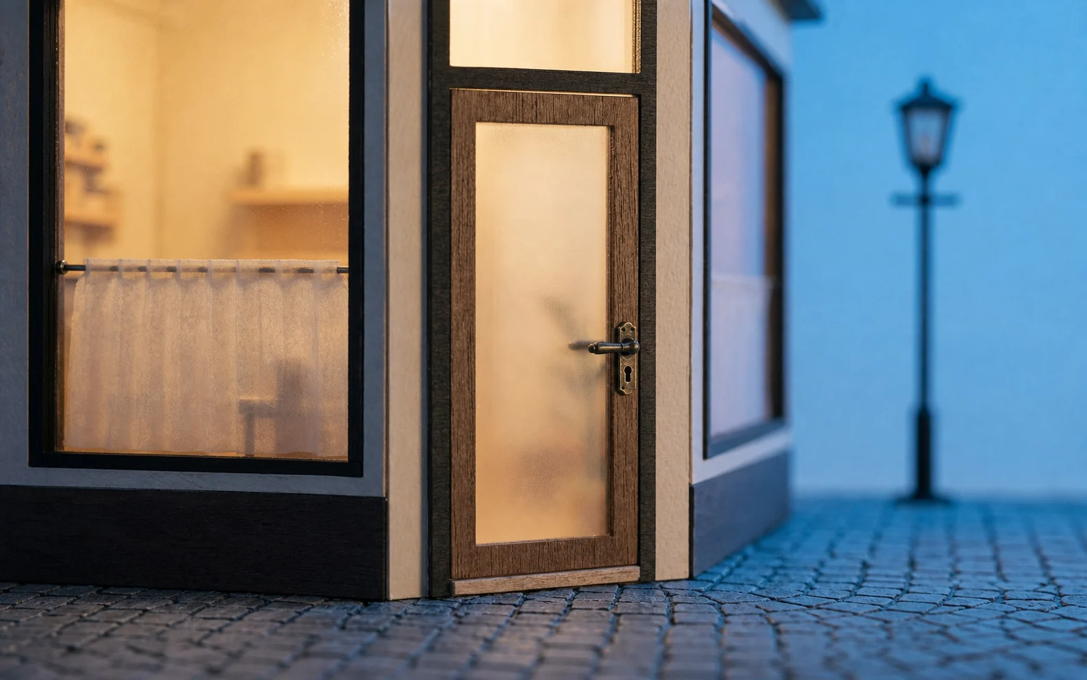 A warmly lit private storefront beside a quiet street